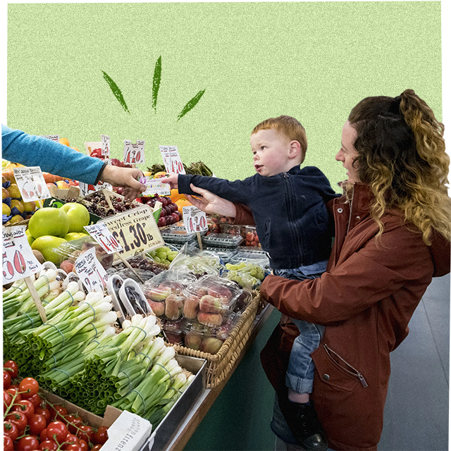 mother and child shopping for fruit and veg